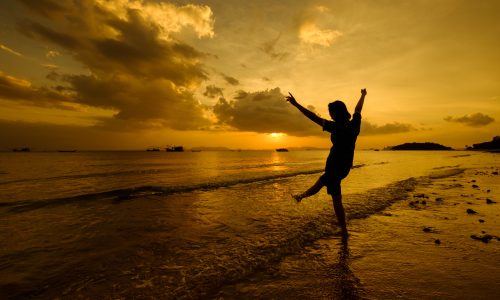 Relax Woman playing sea on the beach   Sunset